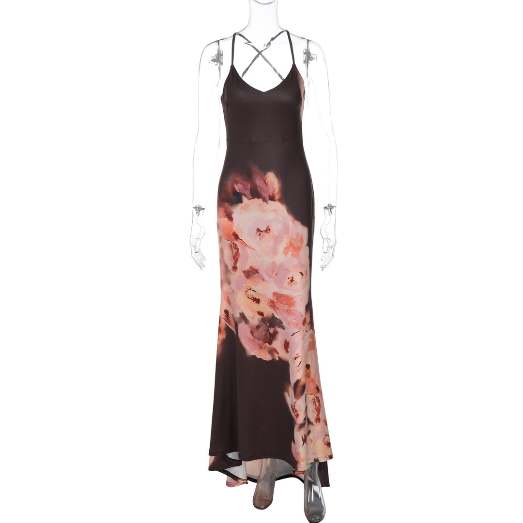 Dame maxikjole med elegant spaghetti-strop design og florale accenter Stilla