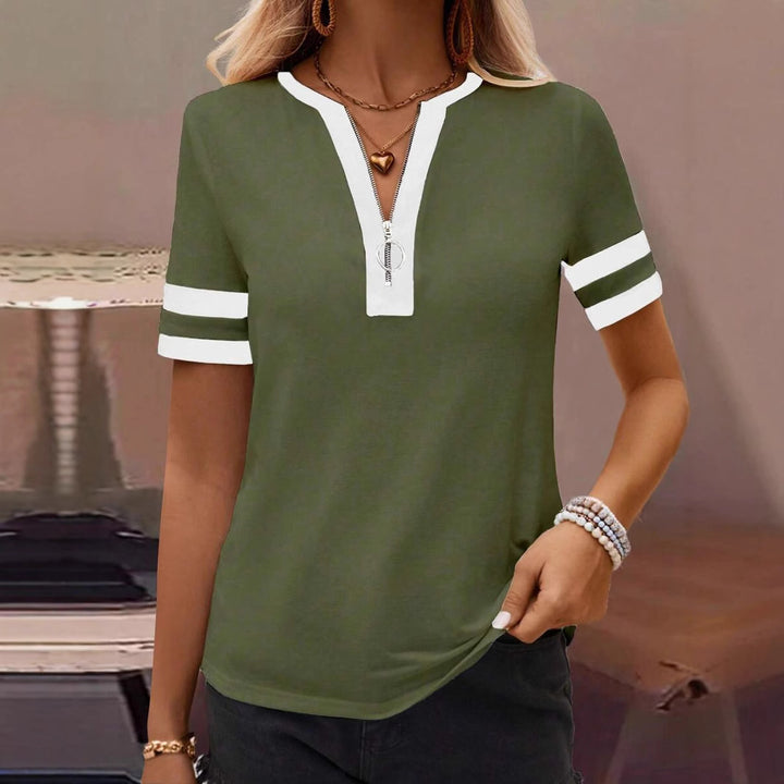 Dame Poloshirt med lynlås og sporty ærmedetaljer Stilla
