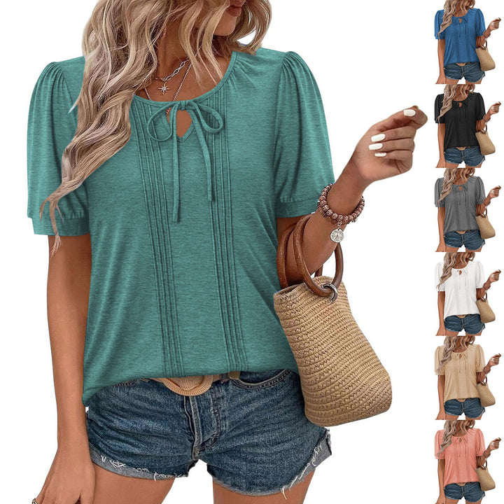 Damebluse med puffærmer og raffineret halterneck Stilla