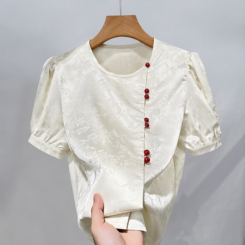Damebluse med elegant struktur og dekorative knapper Stilla