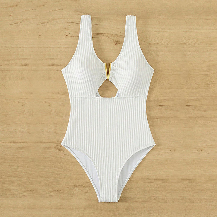 Dame én-delt badedragt med moderne cut-out-design og struktureret stof Skovae