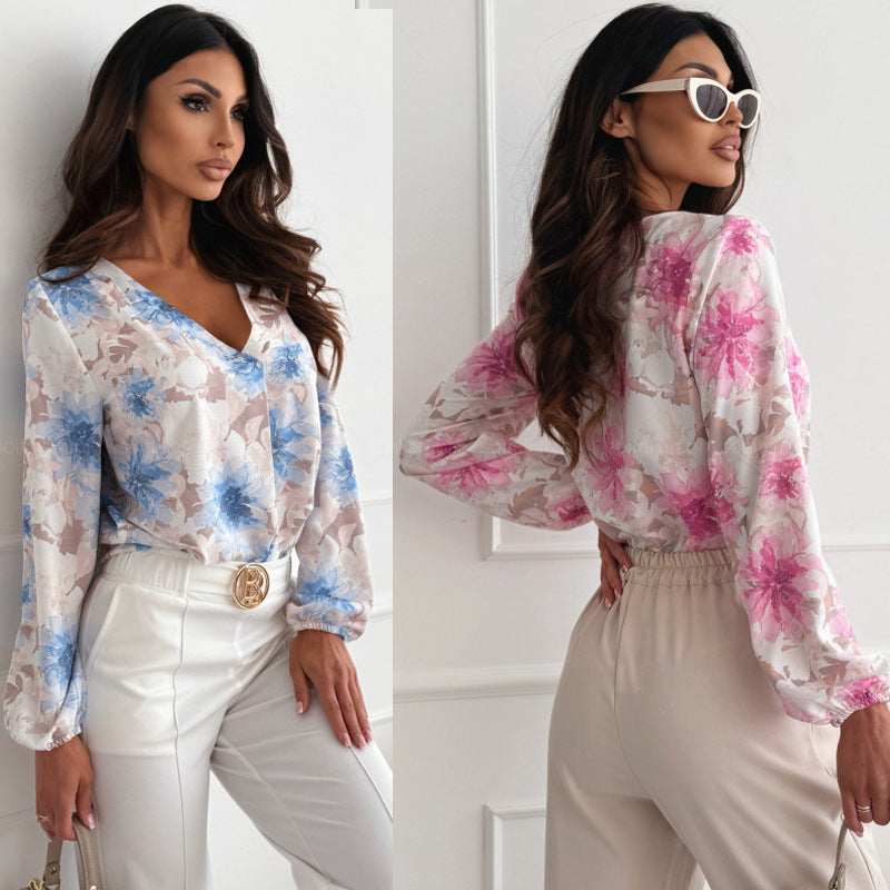 Damebluse med blomsterprint og elegante pufærmer Stilla