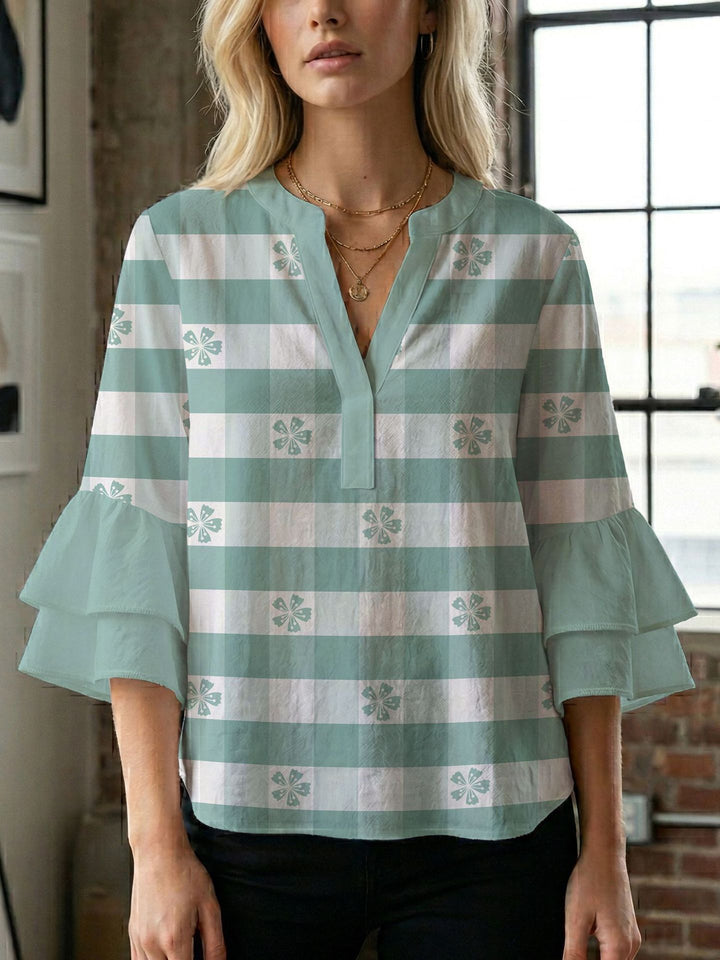 Dame bluse med voluminøse ærmer og kreativt trykdesign Skovae