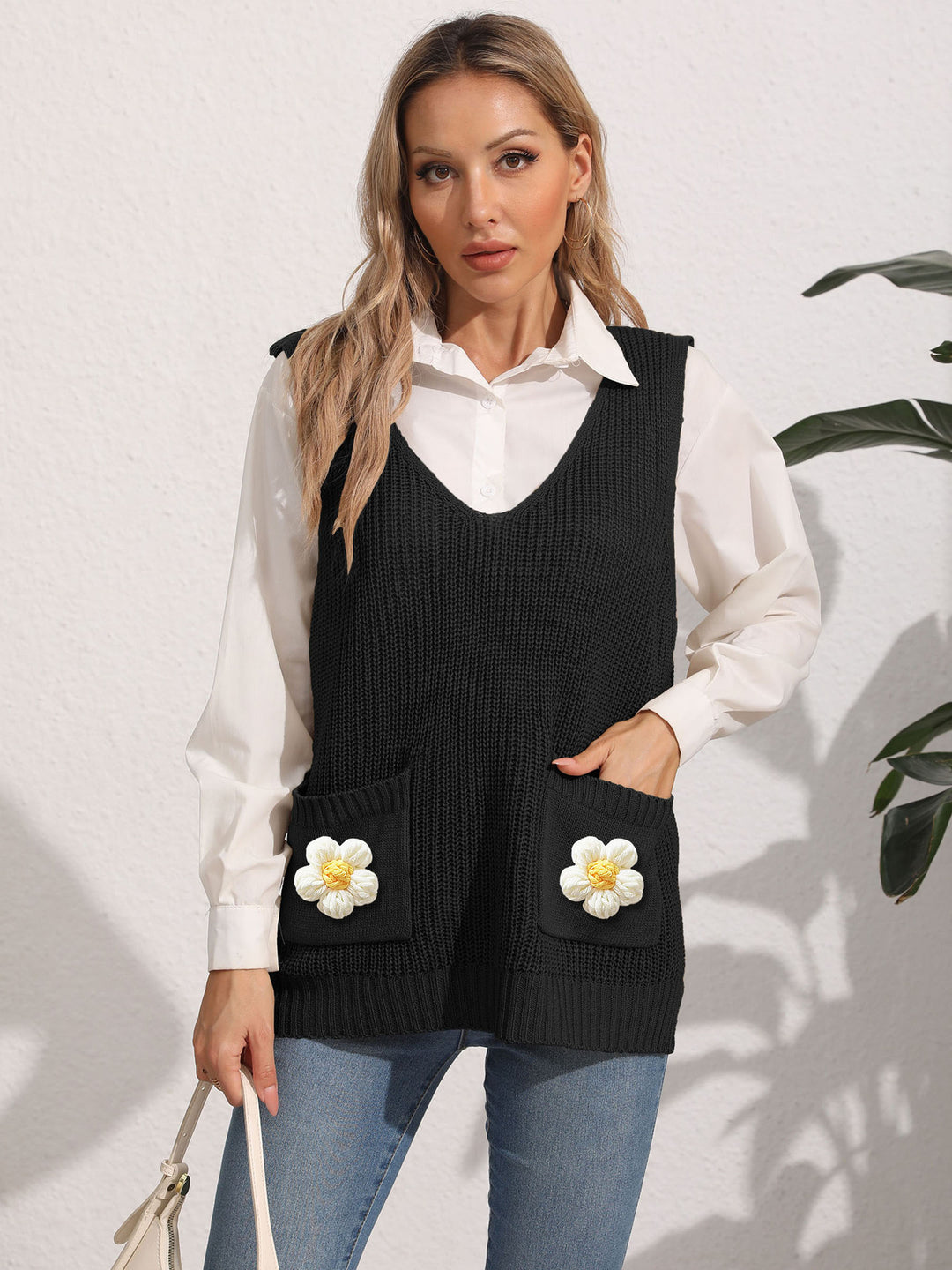 Dame strikvest med lommer og florale applikationer Stilla