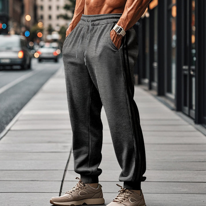 Herre Sporty Joggingbukser med elastisk talje og stilfulde side striber Stilla