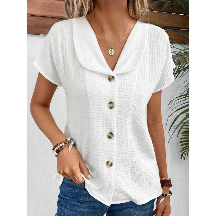 Damebluse med elegant klapkrave og dekorative knapper Stilla