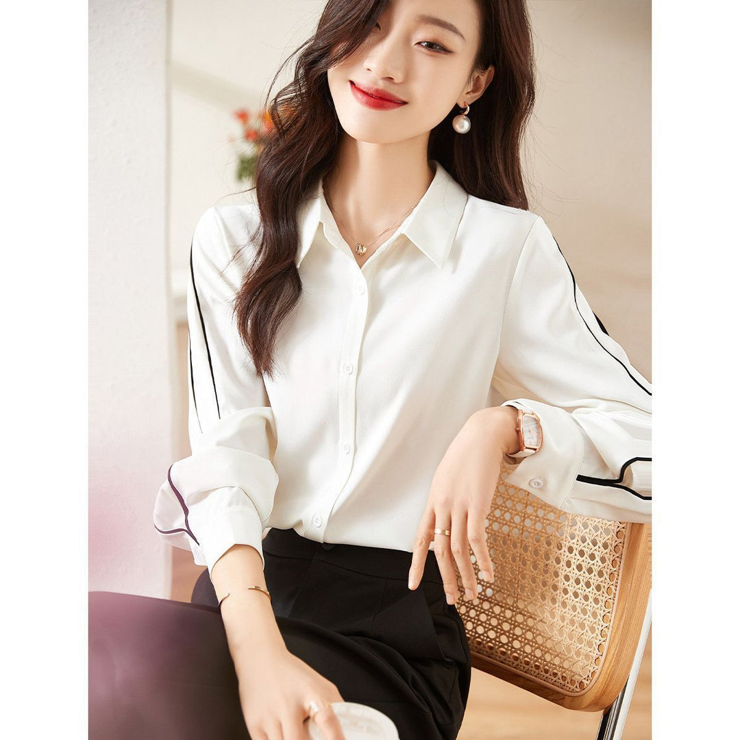 Damernes elegante bluse med klassiske knapdetaljer Stilla
