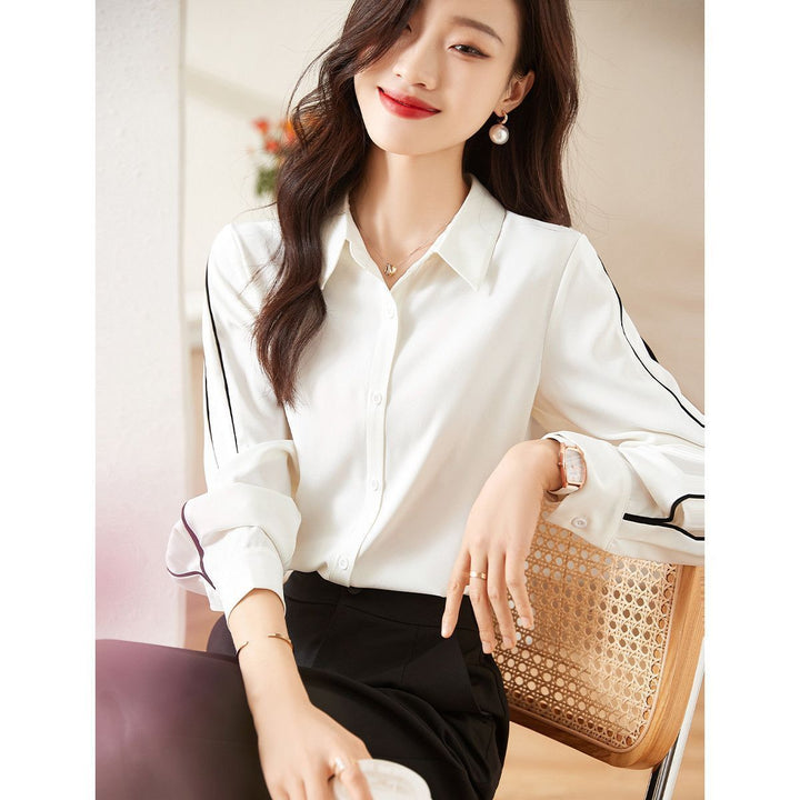 Damernes elegante bluse med klassiske knapdetaljer Stilla