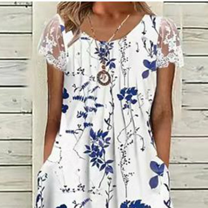 Dame sommerligt fritidskjole med spidsærmer og original blomstertryk Stilla