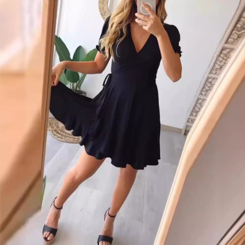 Dame wrapped dress med flydende skørt og elegante pufærmer Stilla