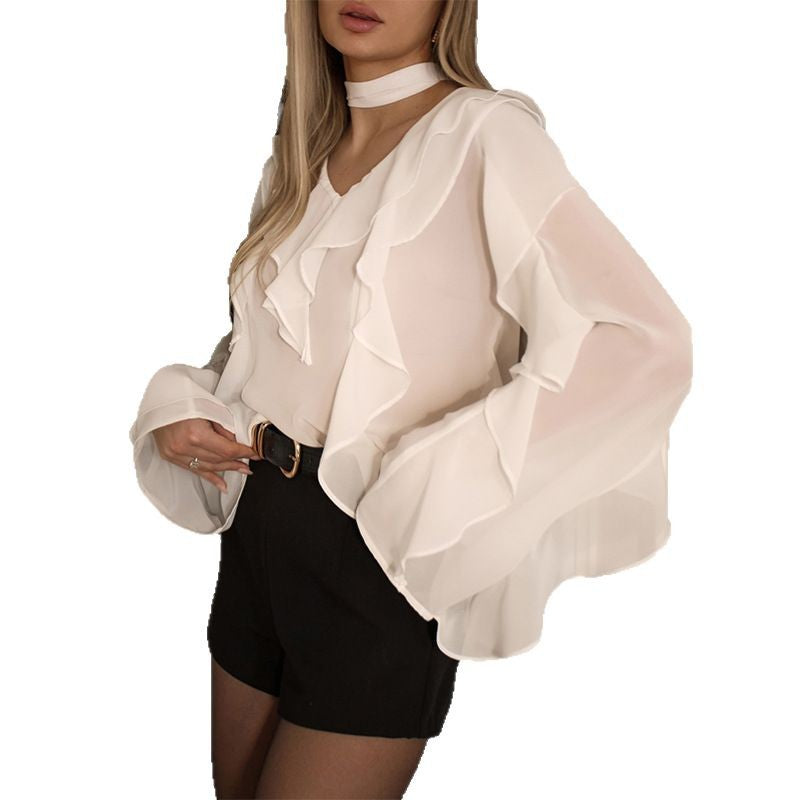 Damebluse med voluminøse flæser og choker-detalje Stilla