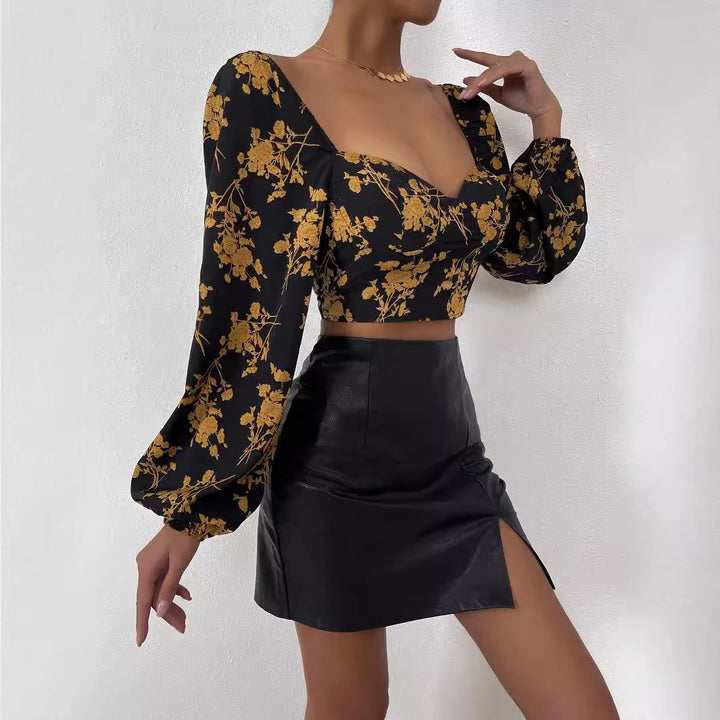 Kvindernes crop top med blomster mønster og elegant puffærme Stilla