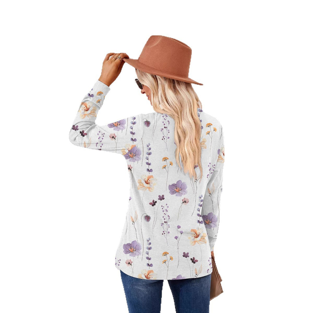 Damebluse med florale mønstre og moderne knapdetaljer Stilla
