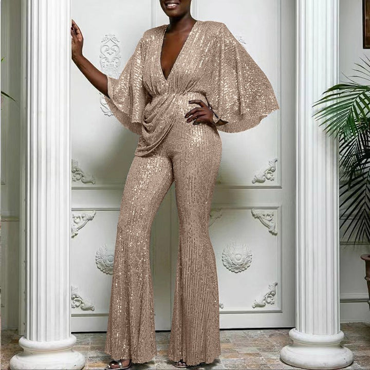 Dame glamourøs jumpsuit med glitrende paletter og vidde ben Stilla