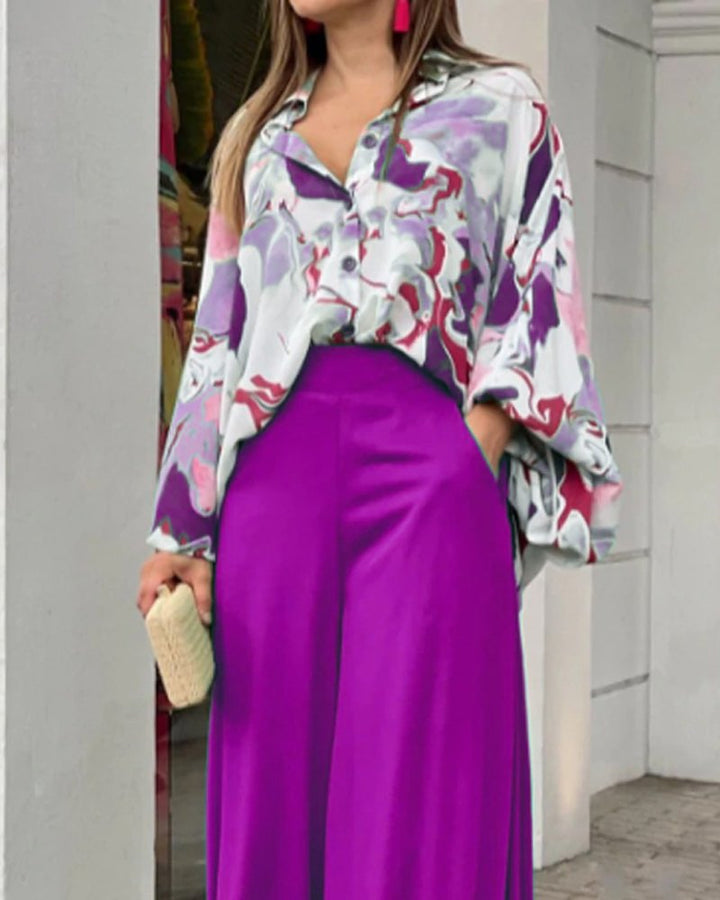 Dame fritidsbluse med farverig marmortryk og loose fit Stilla