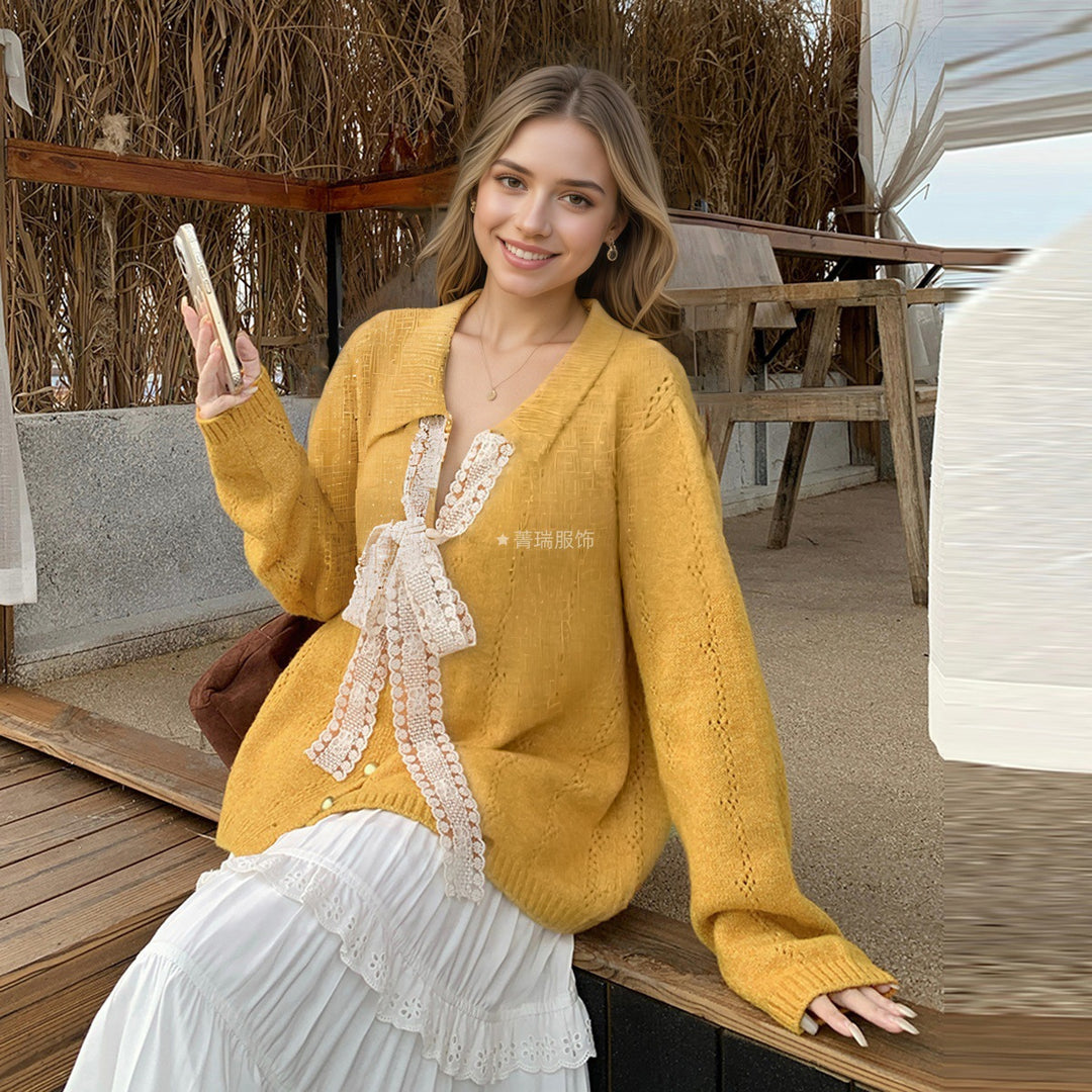 Kvinders strikket sweater med elegant sløjfe applikeret Stilla