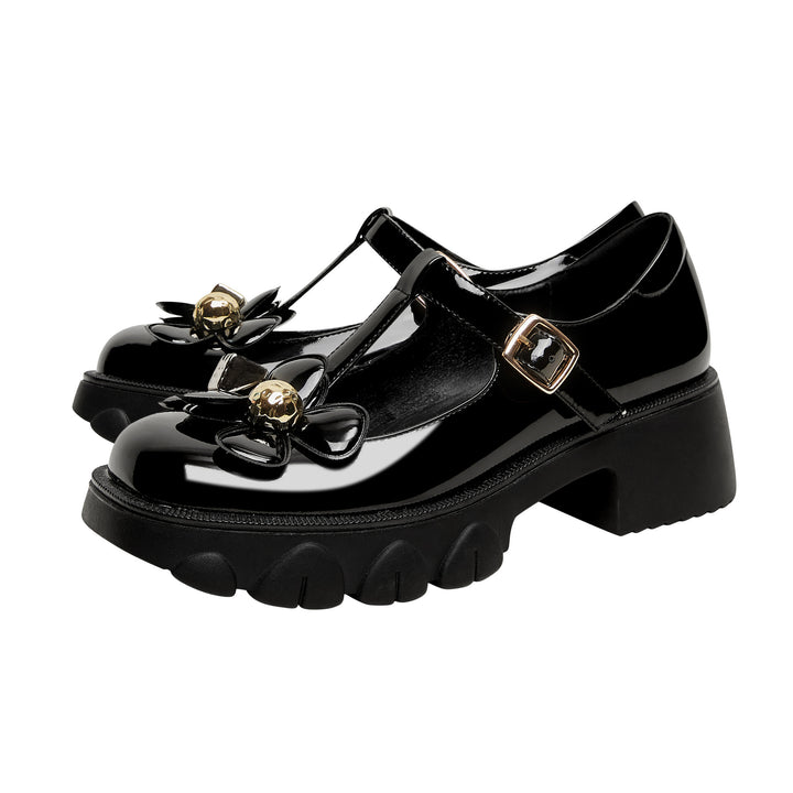 Femme Chunky Heel T-Strap Mary Jane sko med floral accent Stilla