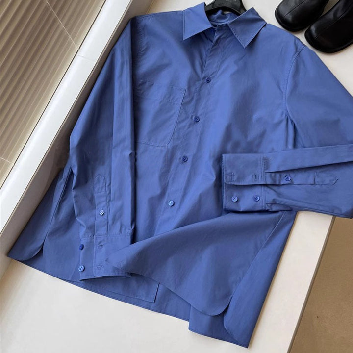 Kvinders elegante langærmede bluse med knaplukning og brystlomme Stilla