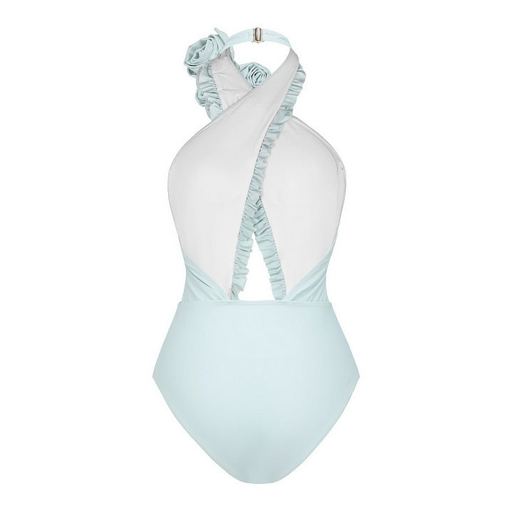 Dame svømmedragt med blomstret design og raffineret cut-out-look Skovae