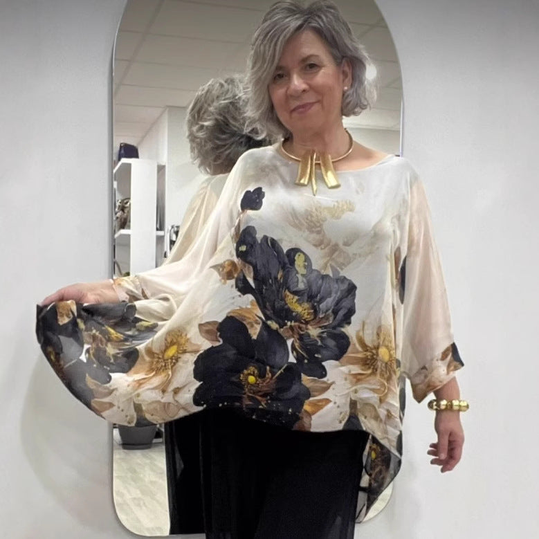 Damebluse med florale accenter og voluminøse ærmer Stilla