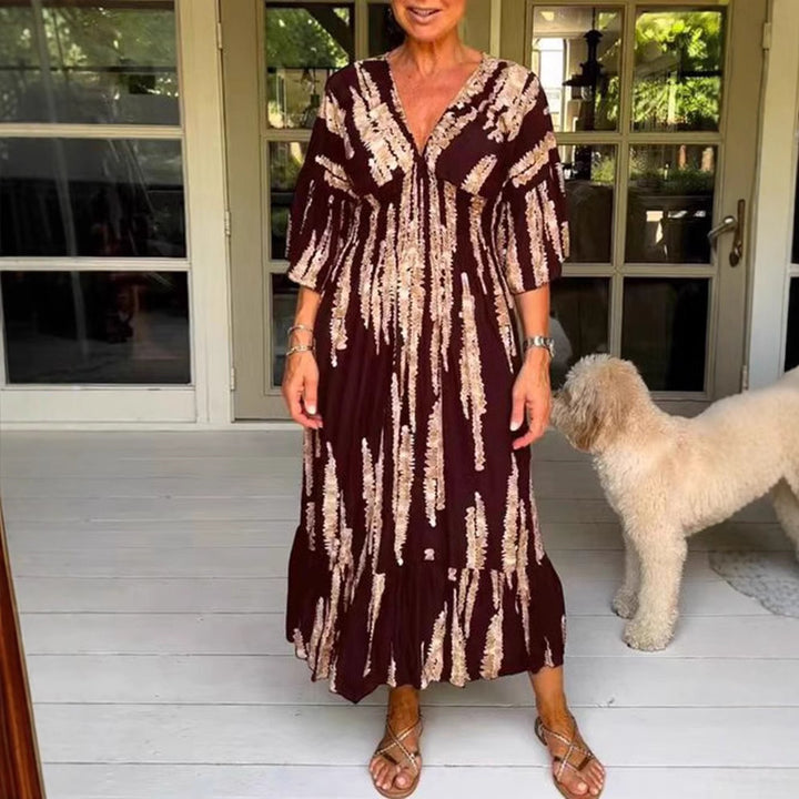 Dame Maxikjole med elegant V-udskæring og flydende skirt Stilla