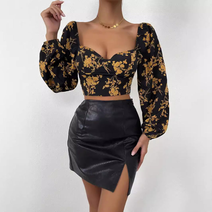 Kvindernes crop top med blomster mønster og elegant puffærme Stilla