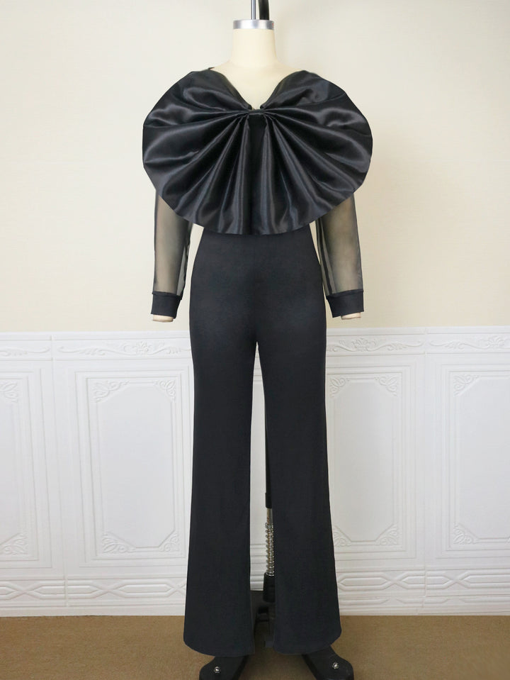 Dame elegant jumpsuit med voluminøs satinkrave og transparente ærmer Skovae