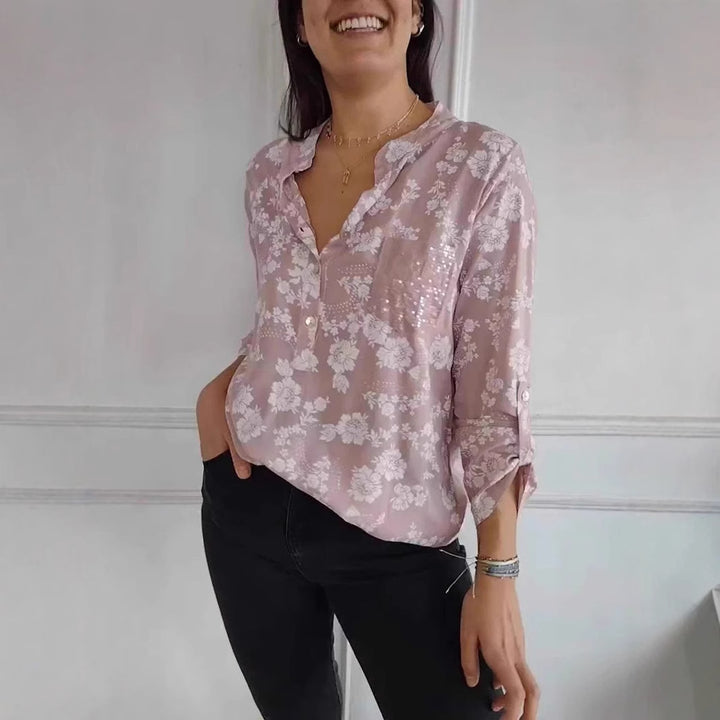 Damebluse med blomstret design og glitrende accenter Stilla