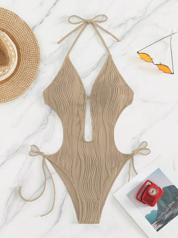 Dame one-piece badedragt med dyb udskæring og ribdesign Skovae