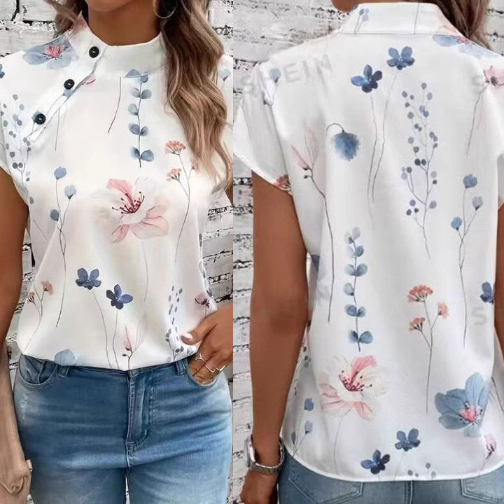 Damebluse med blomsterdesign og capærmer Stilla