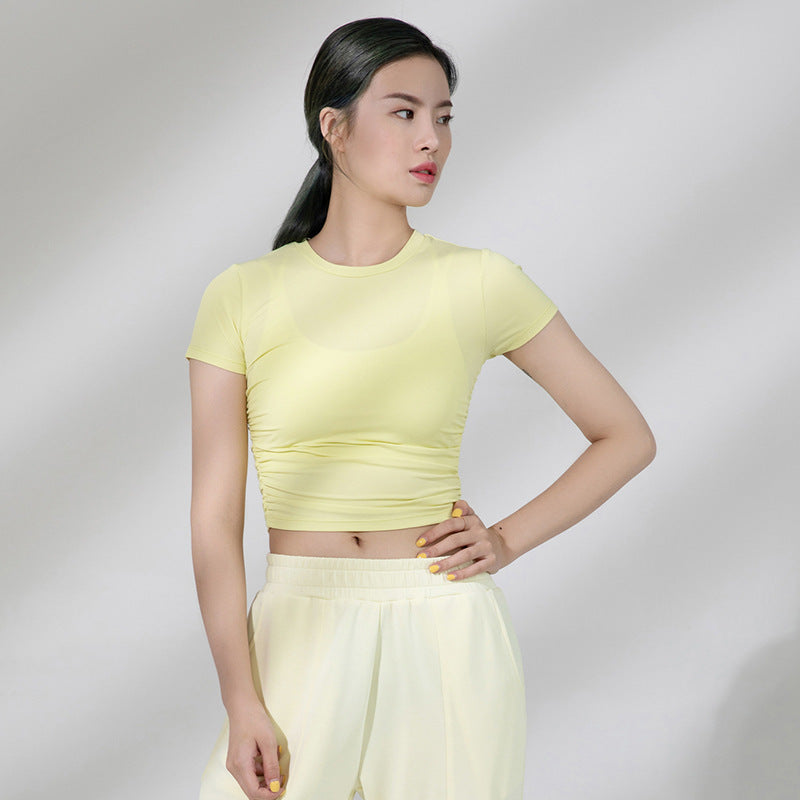 Dame sporty kortærmet crop-top med fashionable rynkeelementer og elastisk pasform Stilla