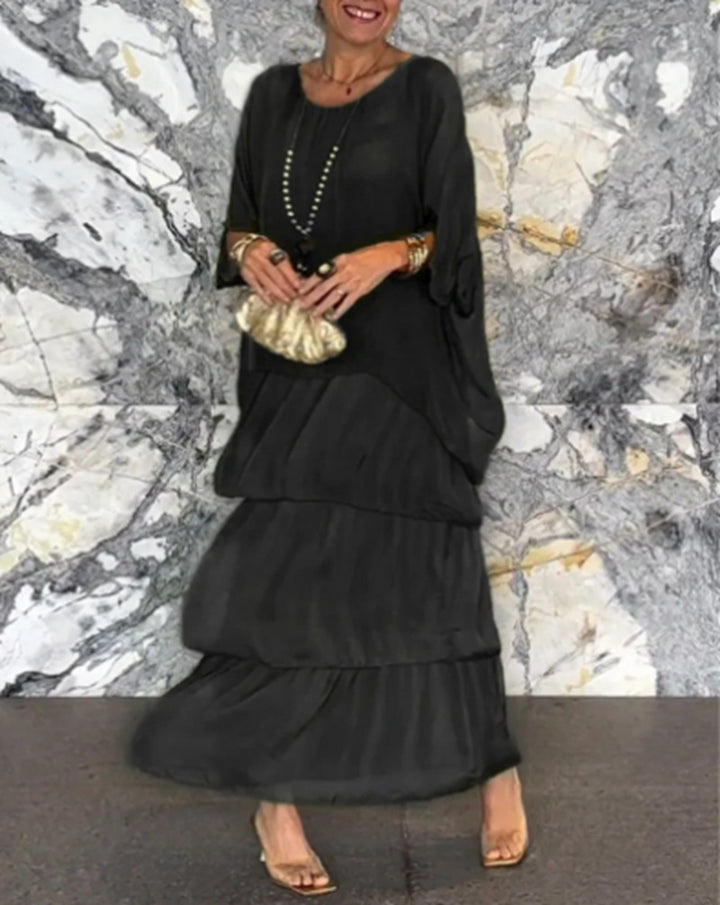 Dame maxikjole med flydende skirt og elegante flæsedetaljer Stilla