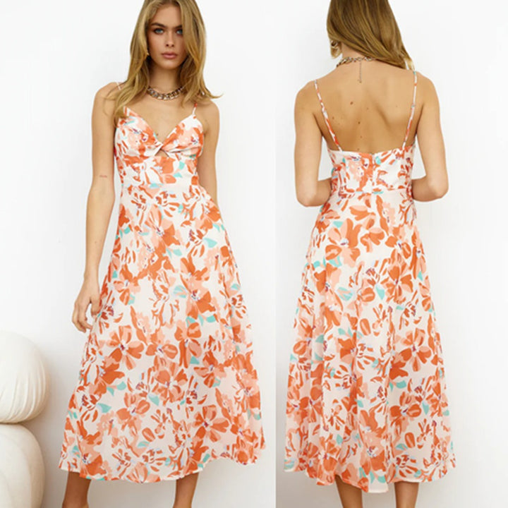 Dame off-shoulder strandkjole med blomsteraccent og svingende kant Stilla