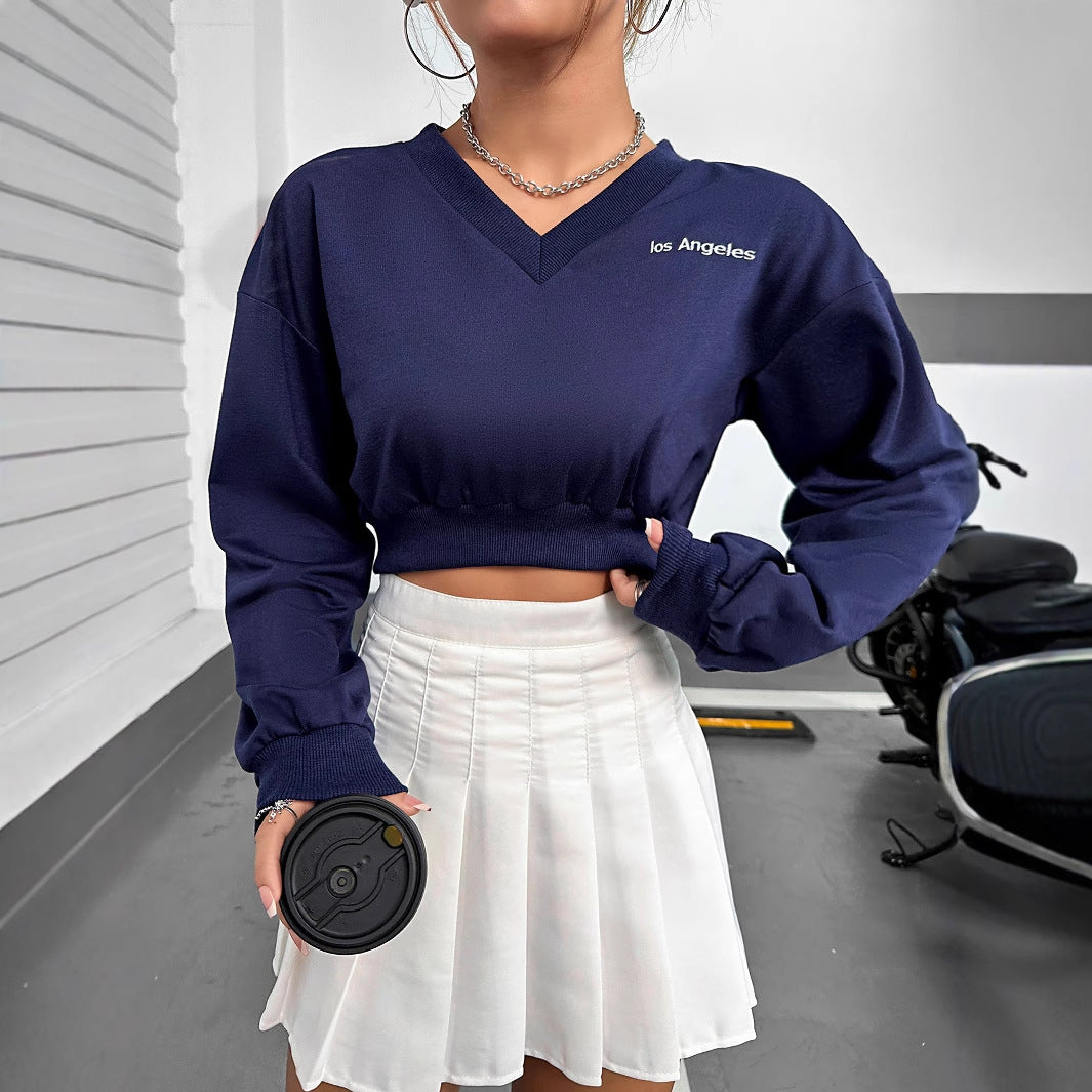 Kvinders afslappede V-hals crop top med elastisk kant og lange ærmer Stilla