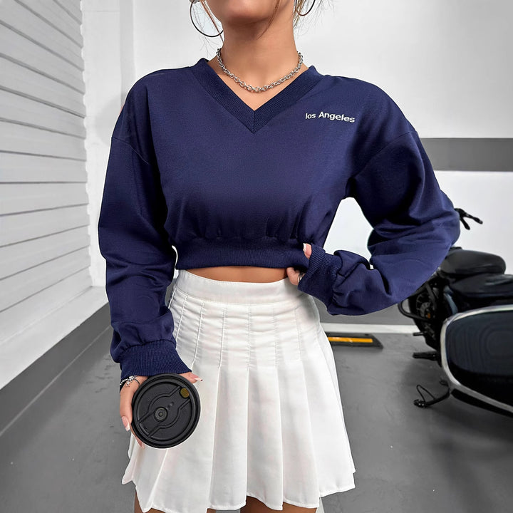 Kvinders afslappede V-hals crop top med elastisk kant og lange ærmer Stilla