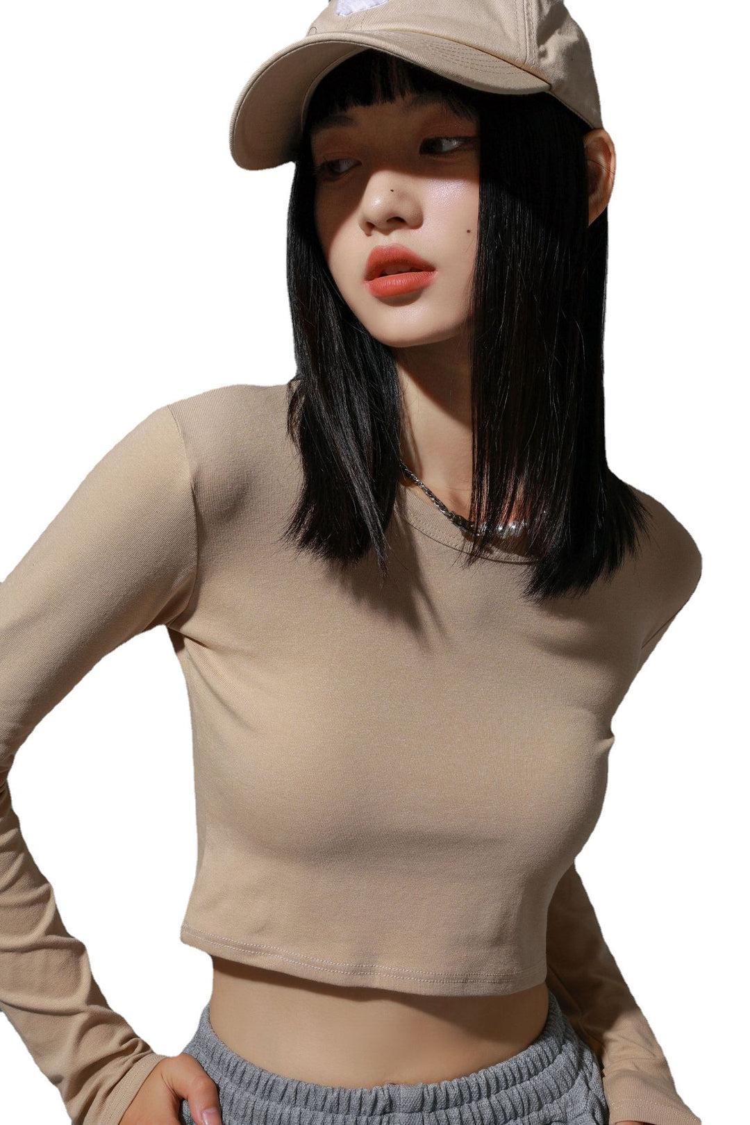 Dame figursyet langærmet crop-top i elastisk materiale med hudvenligt feel Stilla