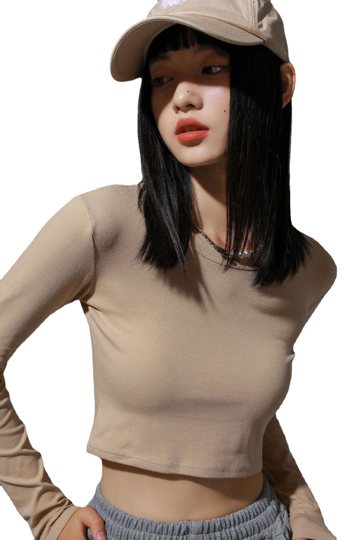Dame figursyet langærmet crop-top i elastisk materiale med hudvenligt feel Stilla