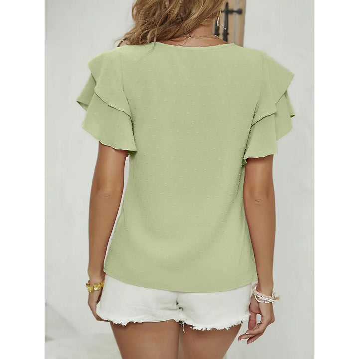 Damebluse med voluminøse flæsedetaljer og elegant strukturmønster Stilla