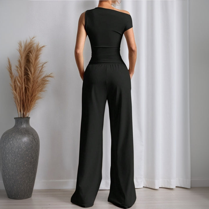 Stilig kvinders jumpsuit med asymmetrisk design og lommer Stilla