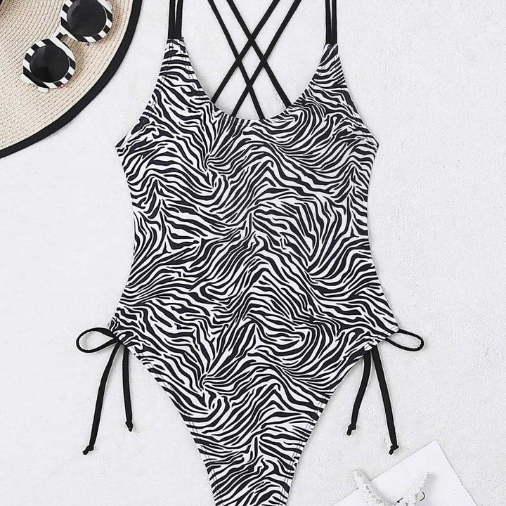 Dame one-piece badedragt med spændende zebra-design og høj benudskæring Skovae