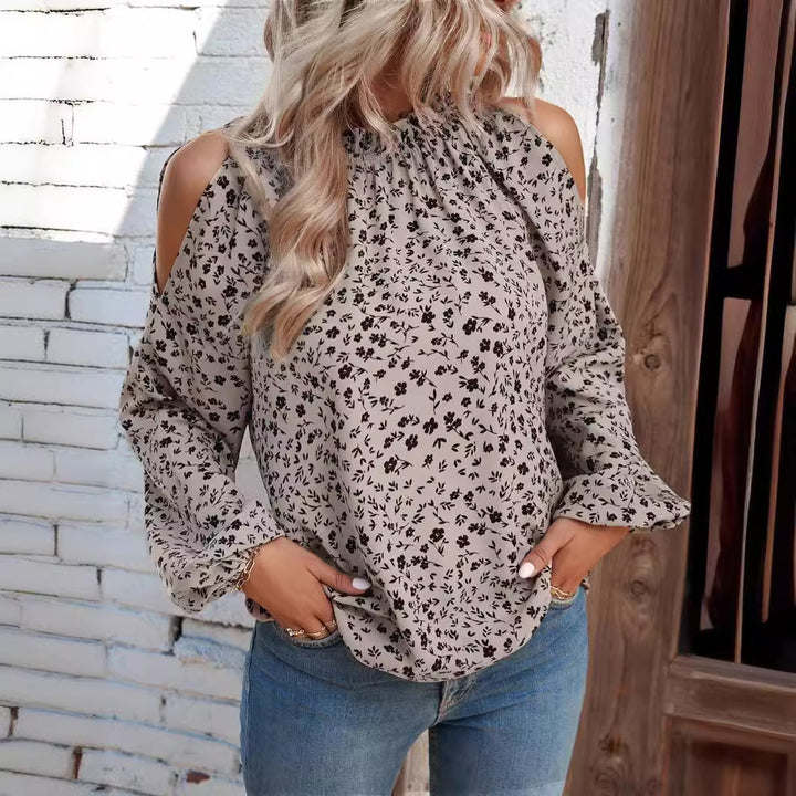 Damebluse i elegant cold-shoulder-design med florale accenter Stilla