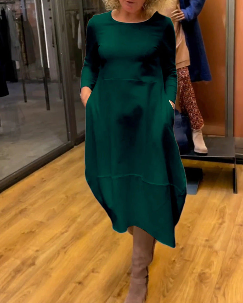 Dame asymmetrisk kjole med praktiske lommer og elegant design Stilla