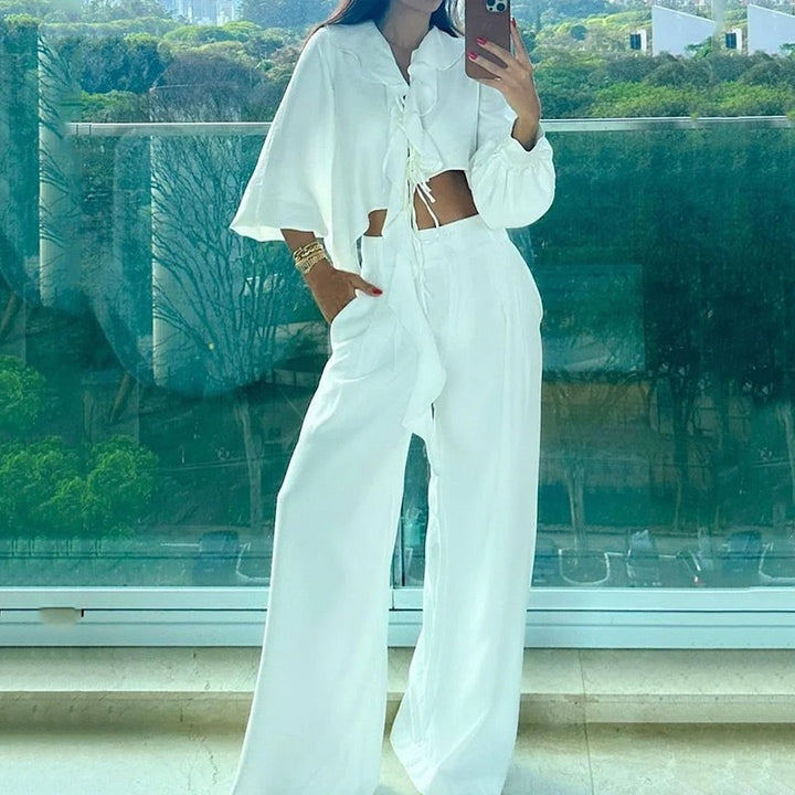 Dame to-delte sæt med asymmetrisk cropped top og brede bukser