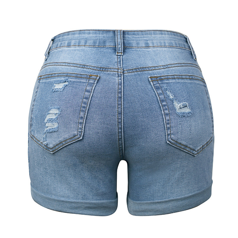 Dame mode denim-shorts med stilige riv detaljer og opfoldet kant Stilla