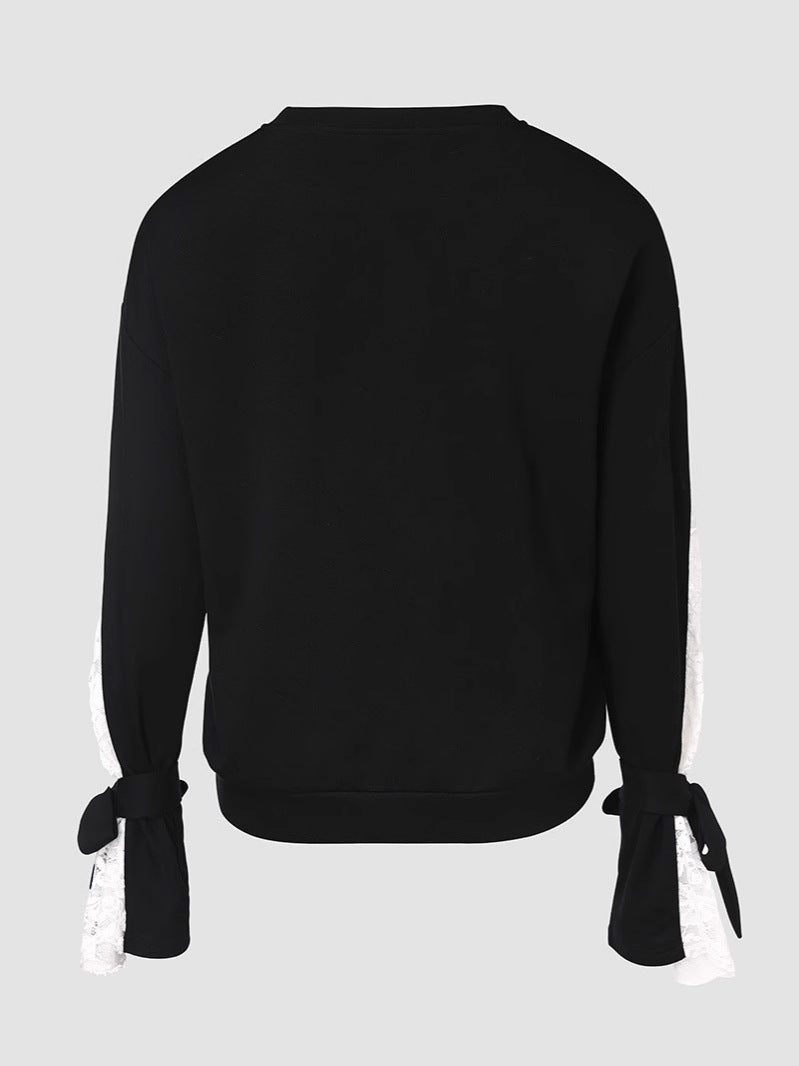 Dame top med elegante spids ærmer og fashionable detaljer Stilla