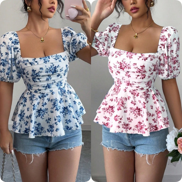 Damebluse med volang og blomsterdesign Stilla