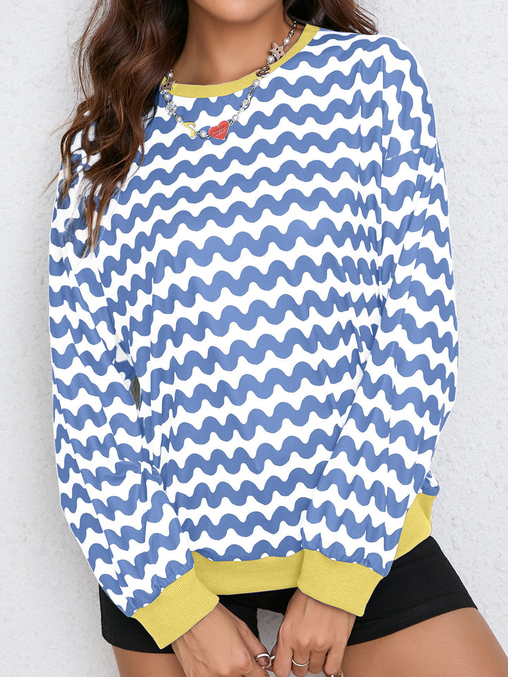 Kvindernes farverige sweatshirt med bølgedesign og sporty snit Stilla