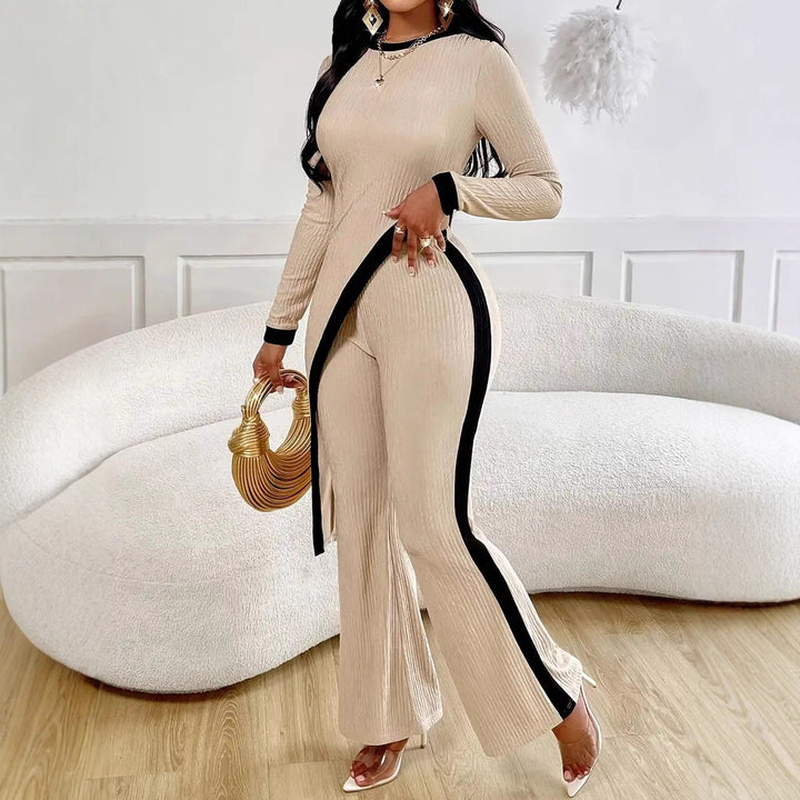Kvinders stilfulde jumpsuit med asymmetrisk design og kontrasterende piping Stilla