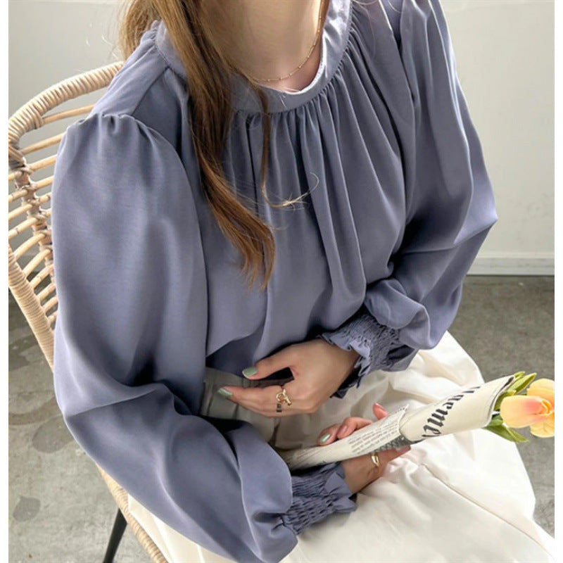Kvindernes elegante bluse med voluminøse ærmer og opretstående krave Stilla
