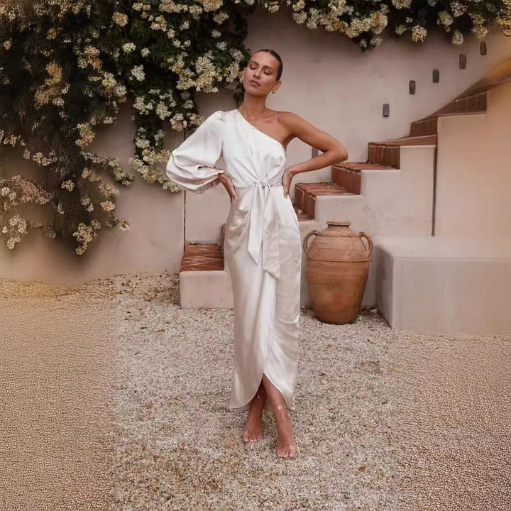 Ladies wrap dress with asymmetric design and elegant waist belt Skovae